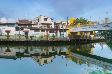 MELAKA, MALAYSIA - June 12, 2022: Colorful street art and painting on the houses along Melaka river. Melaka city is a designated UNESCO world heritage site.