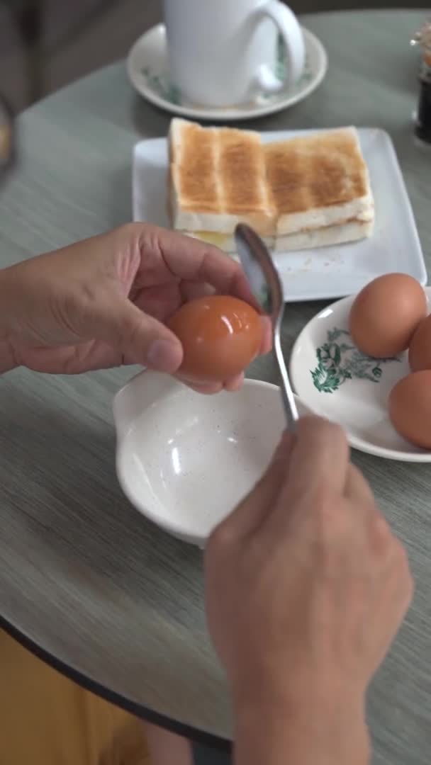 Man Breaking Half Boiled Egg Spoon Healthy Breakfast Concept — ストック動画