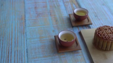 Moon cake with Chinese tea. Mid-autumn festival. Pan shot.