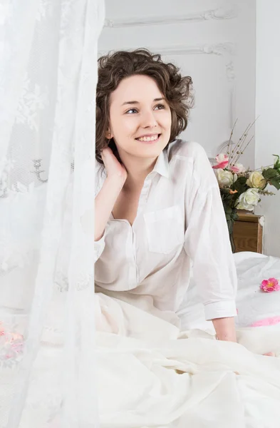 Beautiful girl wakes up — Stock Photo, Image