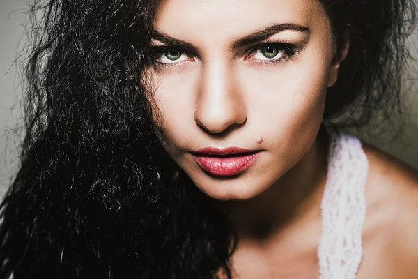 Close-up portrait of hot brunette young woman with demonic look. — Stock Photo, Image