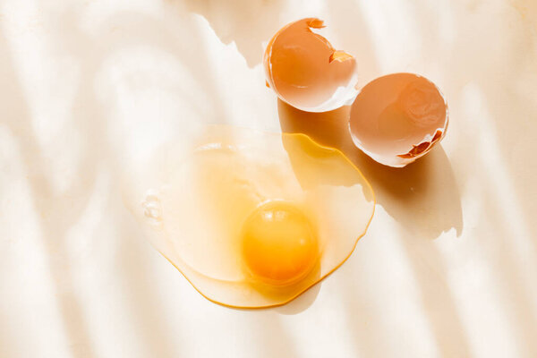 Broken Cracked Brown Chicken Eggshell Raw Egg Pastel Yellow Background Stock Picture