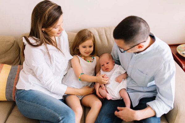 Happy Family Four Sofa Newborn Baby Dad Mom Daughter Son Stock Photo