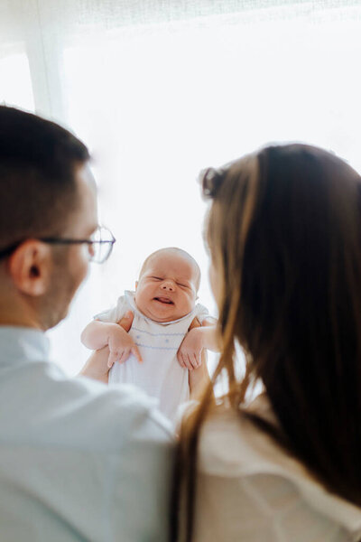 Mother Father Holding Newborn Son Gesturing New Parents Royalty Free Stock Images