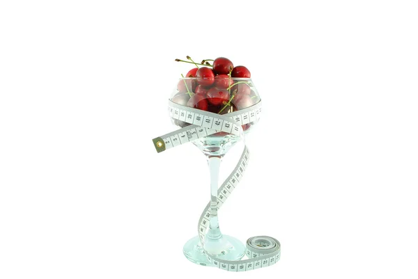 Cherries in a glass and meter — Stock Photo, Image