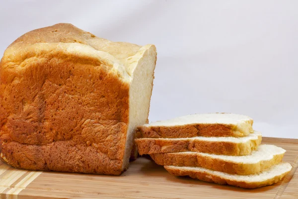 Loaf of homemade white bread sliced — Stock Photo, Image