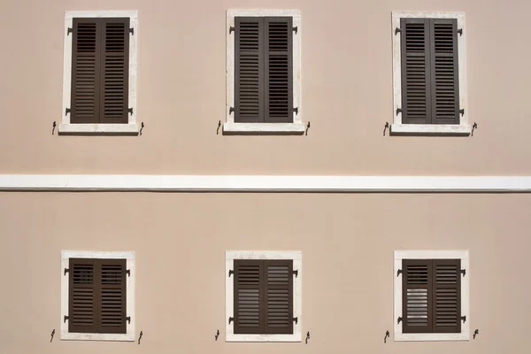 Windows with wooden jalousies — Stock Photo, Image