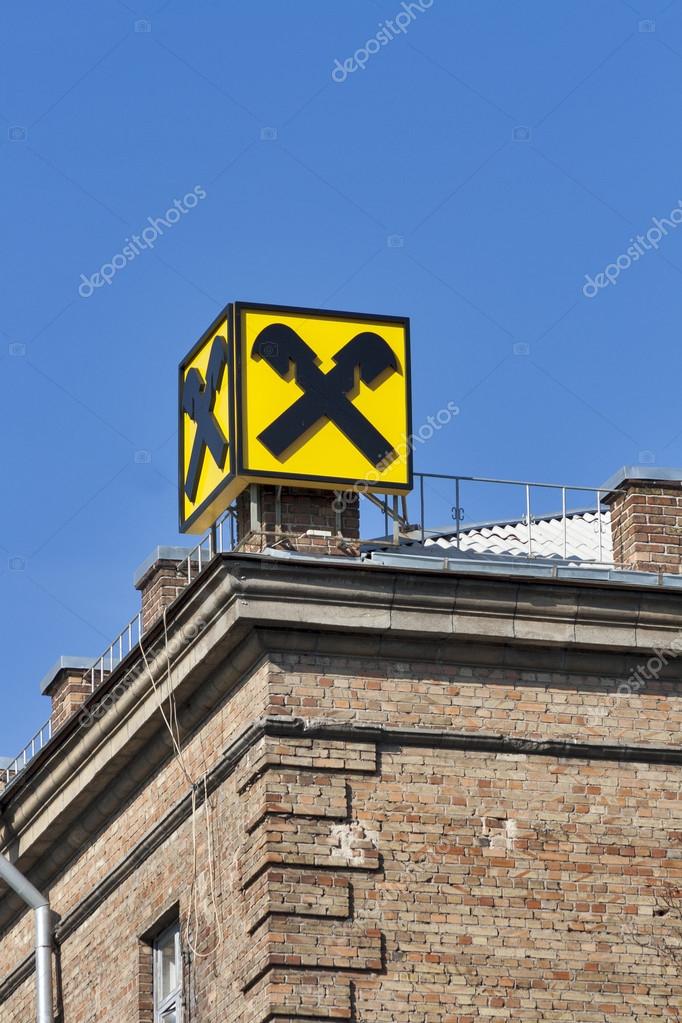Kiev, Ukraine - October 22, 2012: Reiffeisen Bank Aval symbol situated on top of old brick building in Kiev, Ukraine. The Raiffeisen Banking Group is the third largest Austrian bank with net income of about 1,2 billion EUR in 2011. Reiffeisen Group e
