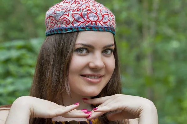 Pretty young woman in a Uzbek skullcap — Stock Photo, Image