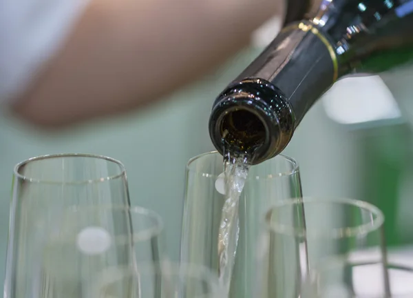 Pouring white champagne for tasting — Stock Photo, Image