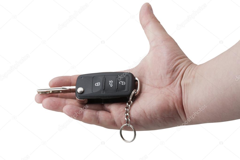 Hand Holding Car Key isolated