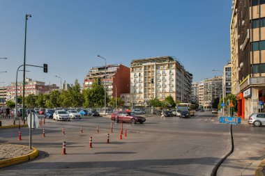 Thessaloniki, Greece - July 27, 2021: Cityscape with car parking lot in front of Mediterranean Palace hotel. It is the second largest city in Greece and the capital of geographic region of Macedonia.
