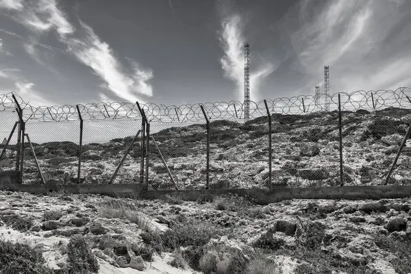 Military Base Barbed Wire Fence Antennas Black White — Stock Photo, Image