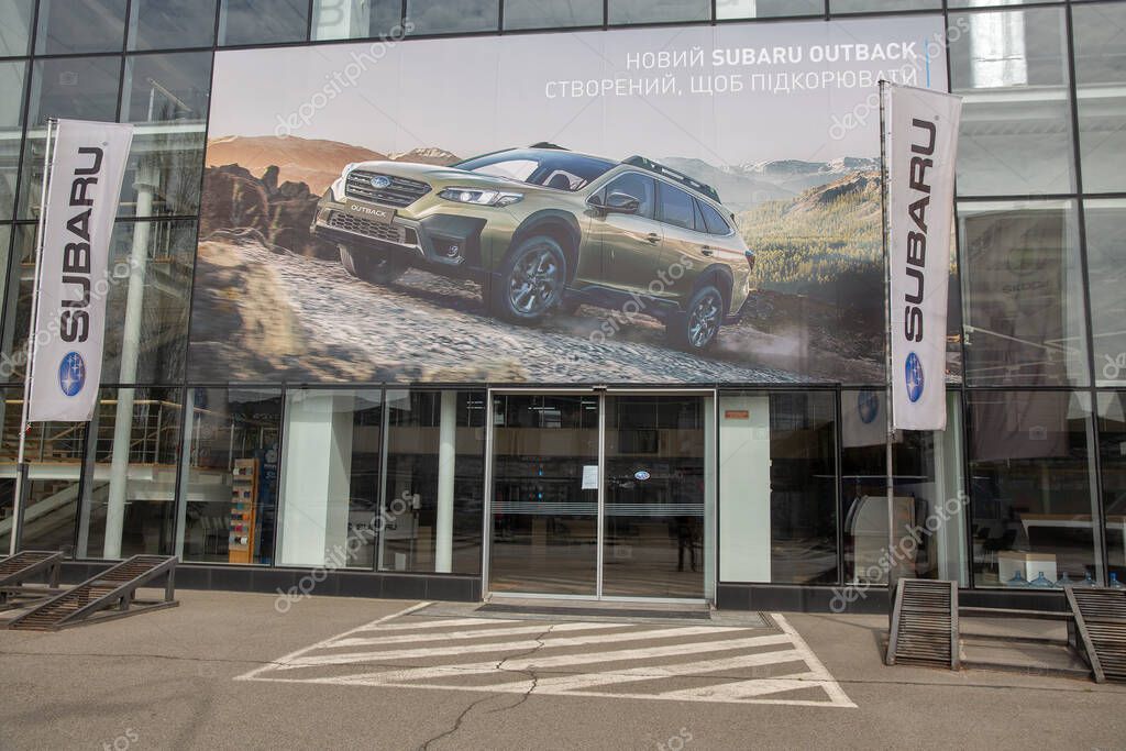 Kyiv, Ukraine - April 27, 2022: Subaru dealership office with Outback advertisement banner. It is the automobile manufacturing division of Japanese transportation conglomerate Fuji Heavy Industries.