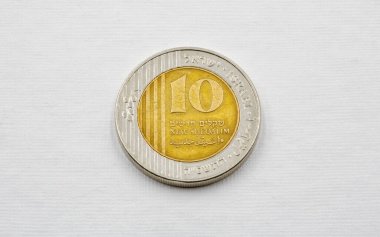 Modern Israeli coin ten sheqel used closeup on the white background