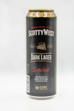 Kyiv, Ukraine - April 24, 2021: Scotty West dark lager beer can closeup against white bacground. It is produced by Latvian company Cesu Alus.