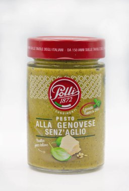 Kyiv, Ukraine - May 08,2021: Polli pesto package closeup on white. Polli is an Italian food company. It produces preserved vegetables, both pickled and in oil, in glass containers.