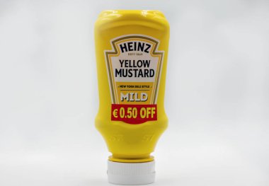 Kyiv, Ukraine - June 02, 2021: Studio shoot of Heinz product in squeezable plastic bottles consisting of Yellow Mustard closeup on white.
