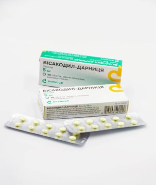 Kyiv, Ukraine - August 23, 2021: Studio shoot of drug Bisacodyl by Darnitsa packs and blisters closeup on white. It is a drug to treat constipation or difficult bowel movements.