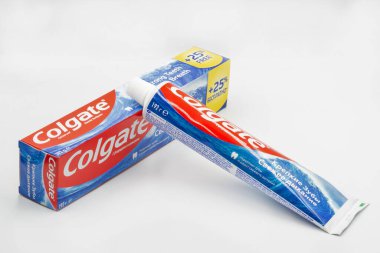 Kyiv, Ukraine - June 18, 2022: Colgate calcium and fluoride toothpaste tube and pack closeup against white. Colgate is a manufacturer of a wide range of toothpastes, toothbrushes, and mouthwashes.