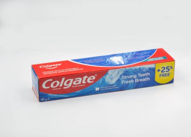Kyiv, Ukraine - October 31, 2021: Colgate pomegranate, calcium and fluoride toothpaste pack closeup on white. Colgate is a manufacturer of a wide range of toothpastes, toothbrushes, and mouthwashes.