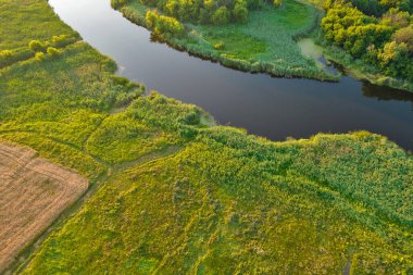 Drone aerial view over summer sunset river Ros landscape, Ukraine.