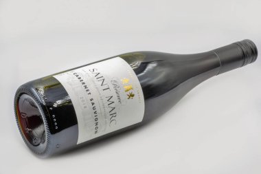 Kyiv, Ukraine - June 10, 2021: Studio shoot of French Reserve Saint Marc Cabernet Sauvignon red wine bottle closeup against white background.