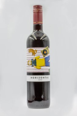 Kyiv, Ukraine - June 10, 2021: Studio shoot of Spanish Horizontal red wine bottle closeup against white background.