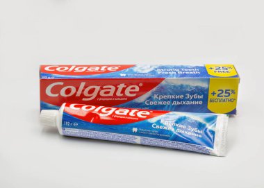Kyiv, Ukraine - Ocyober 31, 2022: Colgate calcium and fluoride toothpaste tube and pack closeup against white. Colgate is a manufacturer of a wide range of toothpastes, toothbrushes, and mouthwashes.