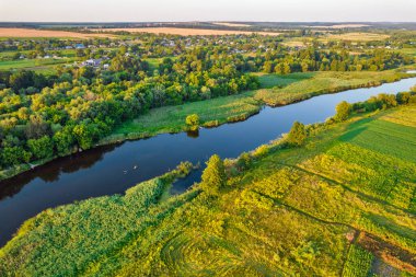 Drone aerial view over summer sunset river Ros landscape, Ukraine.