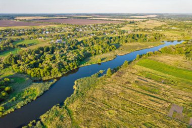 Drone aerial view over summer sunset river Ros landscape, Ukraine.