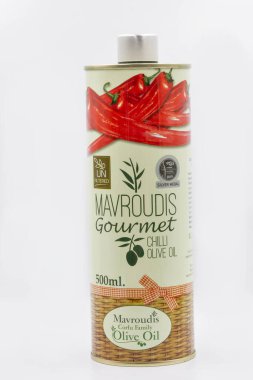 Corfu, Greece - August 05, 2021: Studio shoot of Mavroudis Corfu Family Olive Oil Gourmet Chilli unfiltered tin closeup on white.