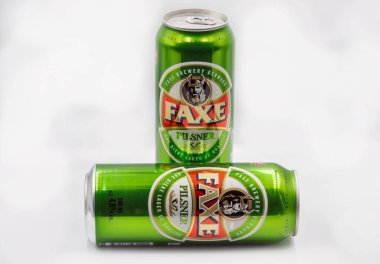 Kyiv, Ukraine - October 02, 2021: Faxe Danish pilsner beer cans closeup against white bacground. Faxe or Fakse is a town on the island of Zealand in eastern Denmark.