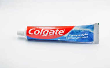 Kyiv, Ukraine - Ocyober 31, 2022: Colgate calcium and fluoride toothpaste tube closeup against white. Colgate is a manufacturer of a wide range of toothpastes, toothbrushes, and mouthwashes.