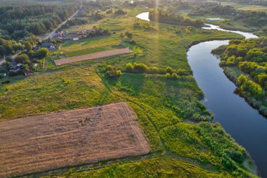 Drone aerial view over summer sunset river Ros landscape, Ukraine.