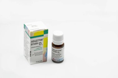 Kyiv, Ukraine - November 21, 2021: Medana Aquadetrim water solution drug Vitamin D3 Cholecalciferol closeup on white. It is a type of vitamin D that is made by the skin when exposed to sunlight.