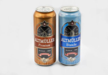 Kyiv, Ukraine - February 23, 2022: Poltava Altmuller Premium and Blanche beer cansGerman beer cans closeup against white bacground.