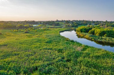 Drone aerial view over summer sunset river Ros landscape, Ukraine.