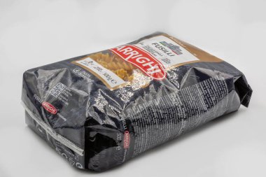 Kyiv, Ukraine - November 21, 2021: Pasta Berutto Arrighi Fusilli pack closeup on white. It is a sort of long and spiral twisted soup pasta, or medium length and helical shaped.