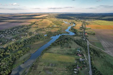 Drone aerial view over summer sunset river Ros landscape, Ukraine.