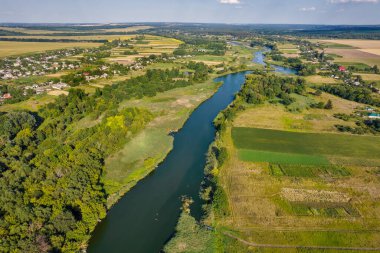 Drone aerial view over summer river Ros landscape, Ukraine.