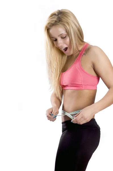 Mujer midiendo su cintura Imagen De Stock