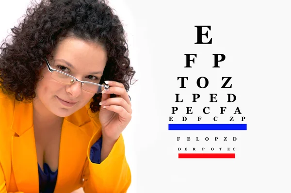 Optometrist or optician with eyewear glass — Stock Photo, Image