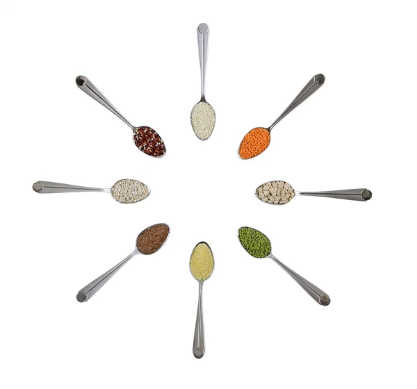 Spoons with different cereals — Stock Photo, Image