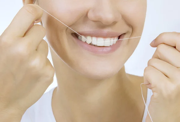 Woman and teeth floss — Stock Photo, Image