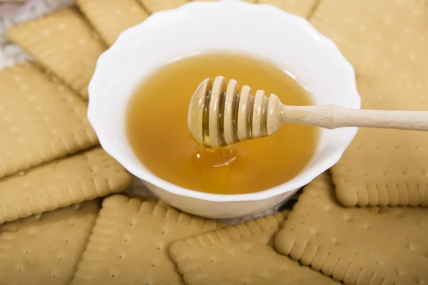 Honig und Kekse — Stockfoto