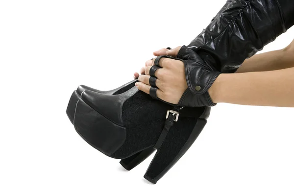 Female foot in stylish black leather boots — Stock Photo, Image