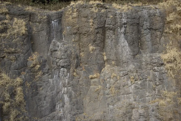 Textura de roca oscura. Fondo de piedra — Foto de Stock