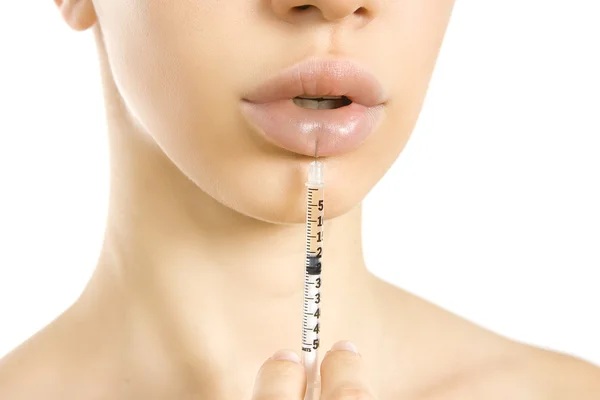 Beautiful woman getting an injection in her lips. — Stock Photo, Image