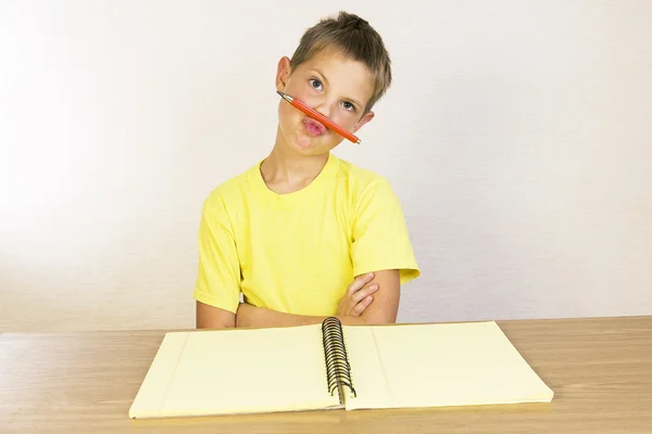 Portrait of a pouting boy, schoolboy a joke and does not want to — Stock Photo, Image